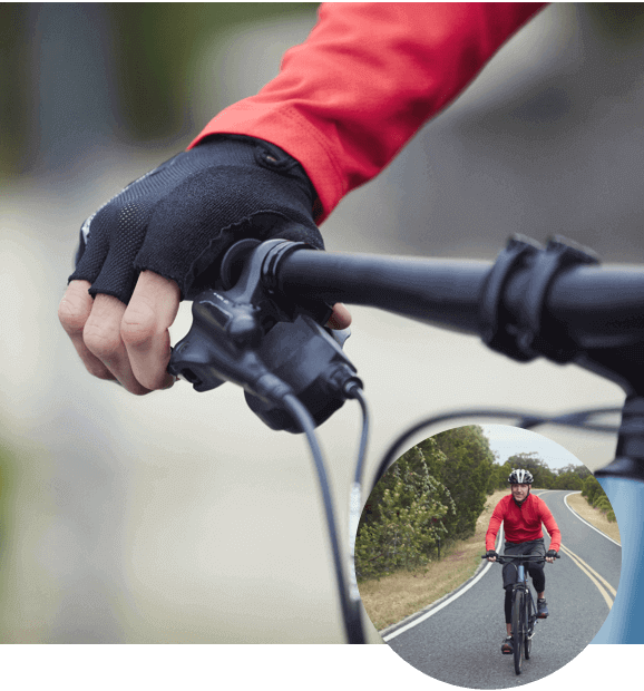 Person gripping bike handle