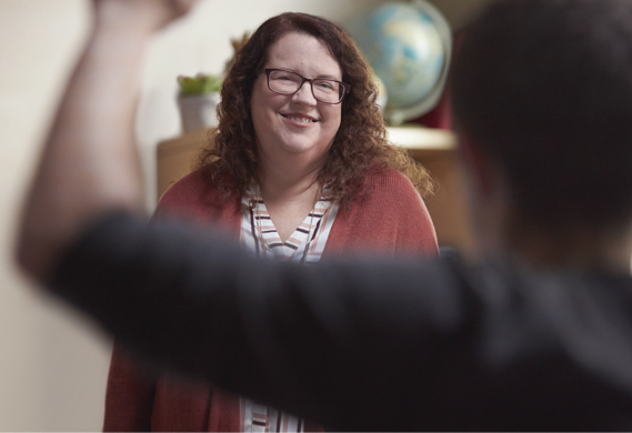 Woman smiling about managing her RA symptoms Woman Smiling