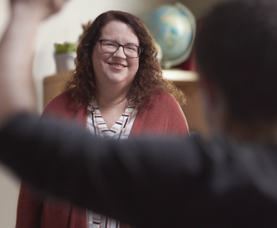 Woman smiling about managing her RA symptoms Woman Smiling