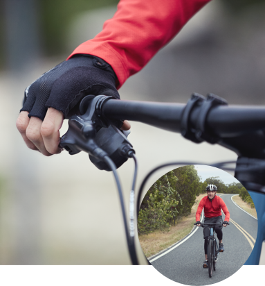 Person gripping bike handle Person gripping bike handle
