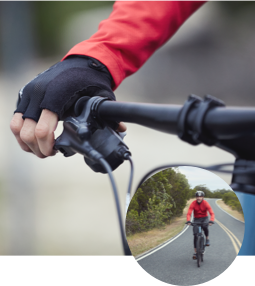 Person gripping bike handle