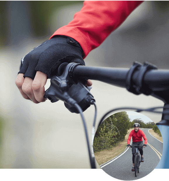 Person gripping bike handle Person gripping bike handle