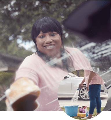 Woman Washing a Car Outside