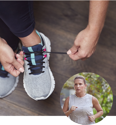 Woman tying her shoes to prepare for a jog
