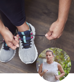 Woman tying her shoes to prepare for a jog Woman Tying Shoes to go on a run